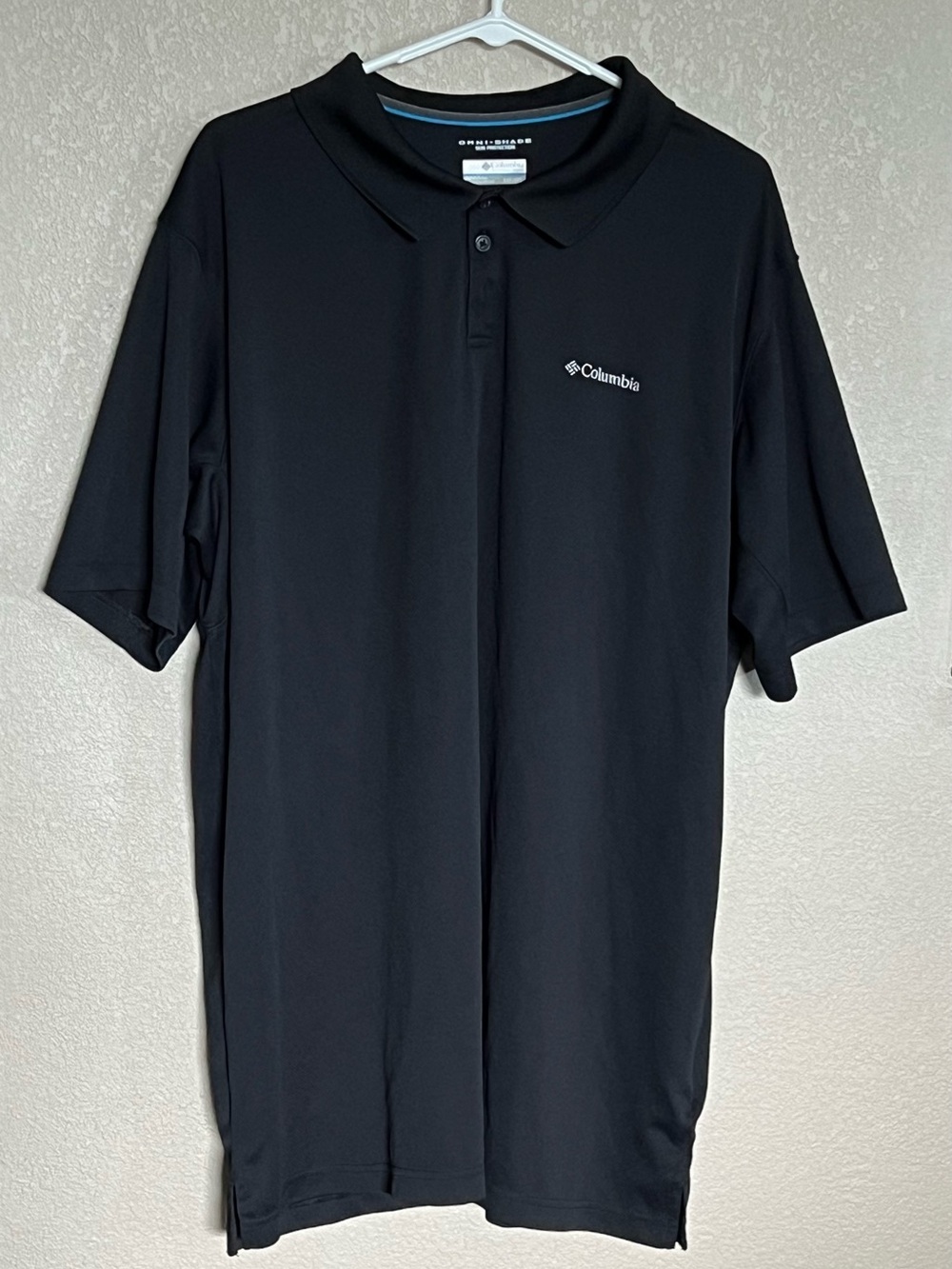 Omni Shade Columbia Black Short-Sleeve Polo with Subtle Logo